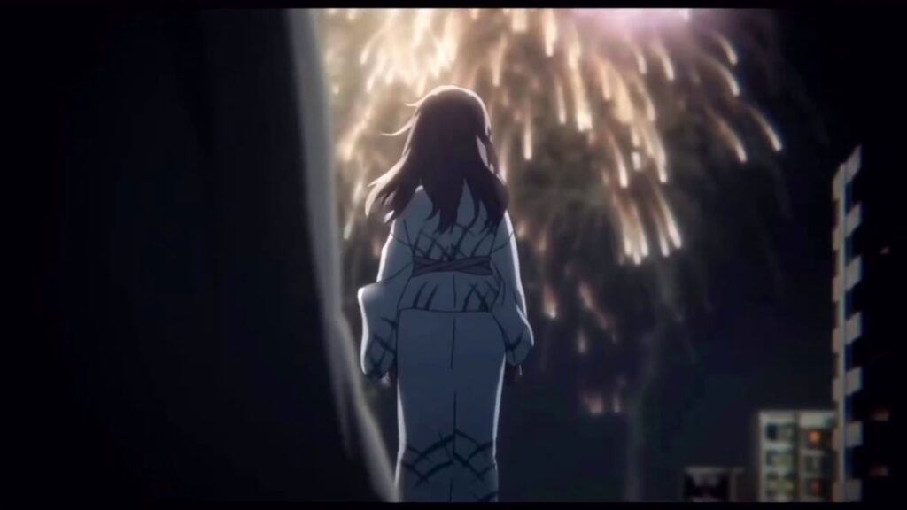 A silhouette of a girl watching a fireworks display